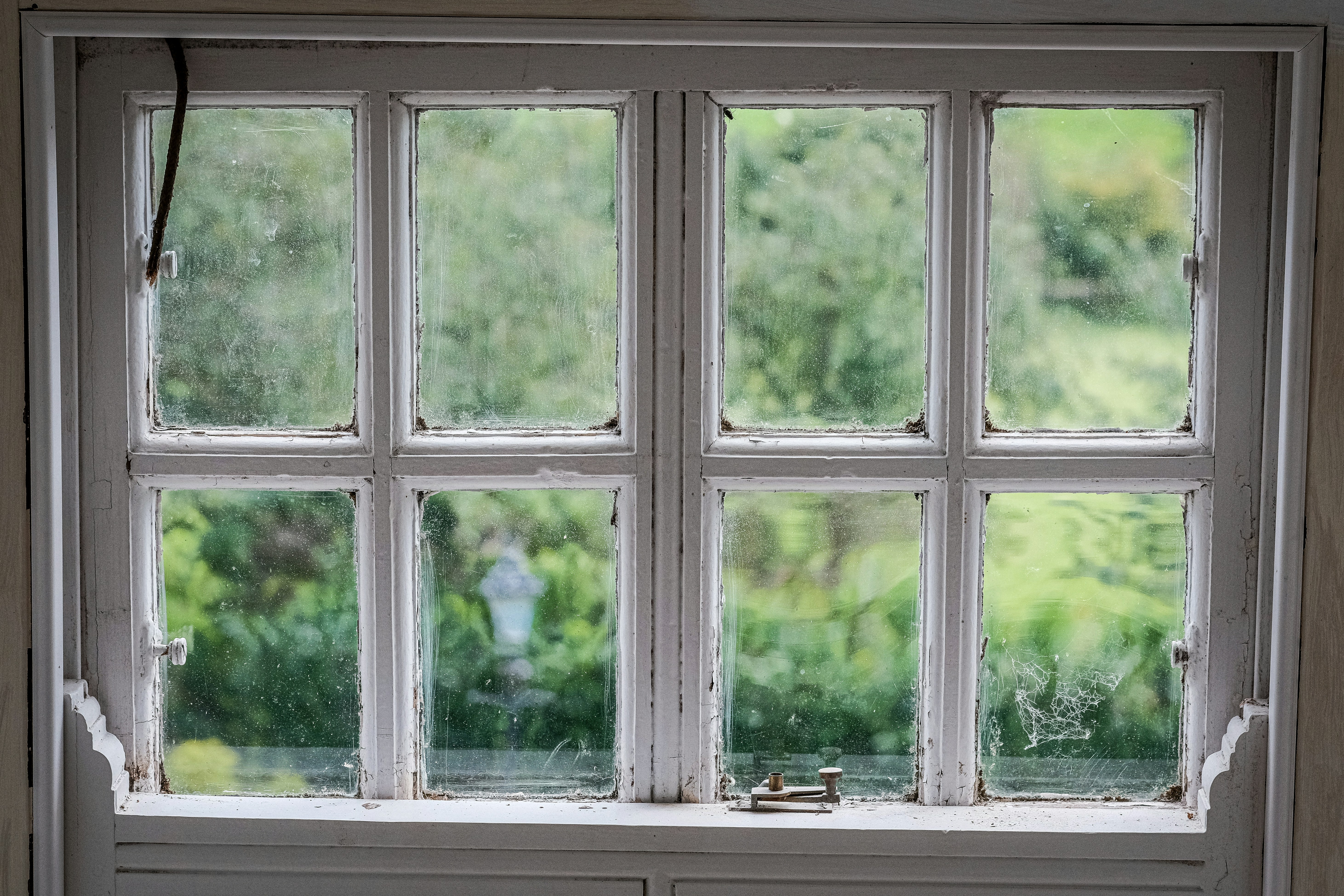 Failed insulated glass unit showing permanent fog between the panes on a Denver home